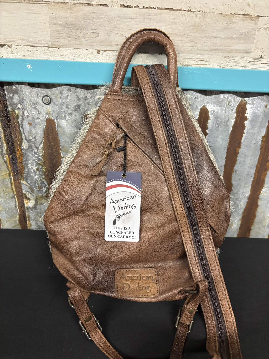 Convertible Cowhide Sling Backpack by American Darling